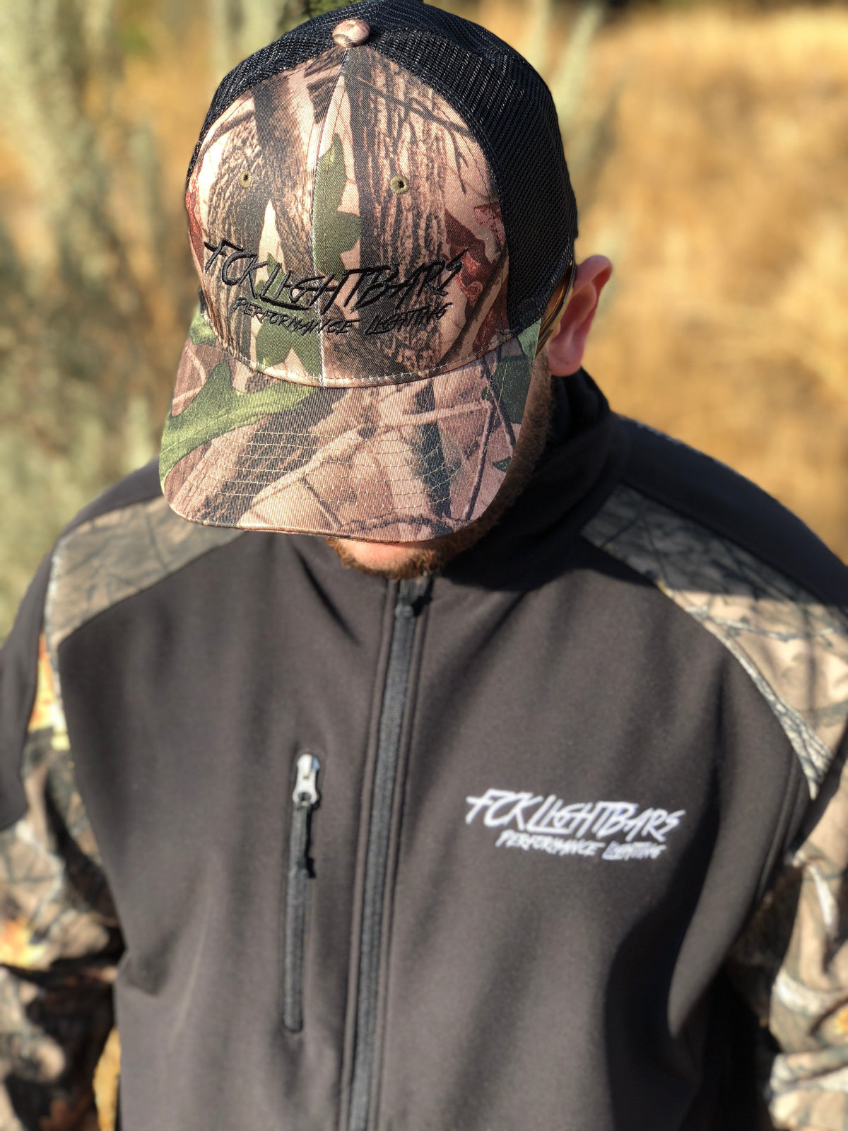 A man wearing Camo Snapback Hat (Black)