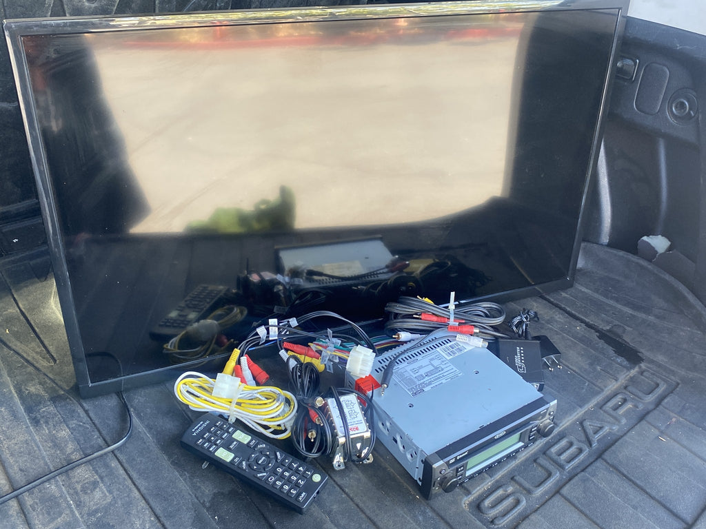 Jensen JDVD1500 with included wiring; TV and remote shown for testing only, not included